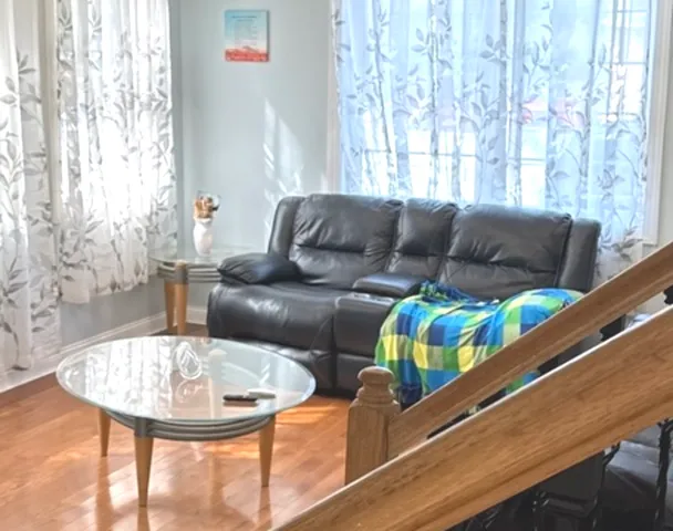 a living room with furniture and a table