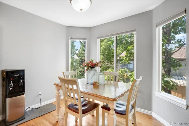 a kitchen with stainless steel appliances granite countertop a sink a stove and a refrigerator