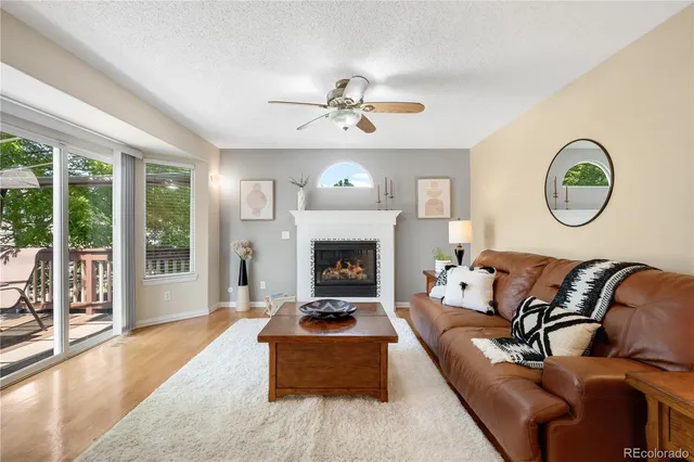 a bedroom with a bed a couch and a chandelier