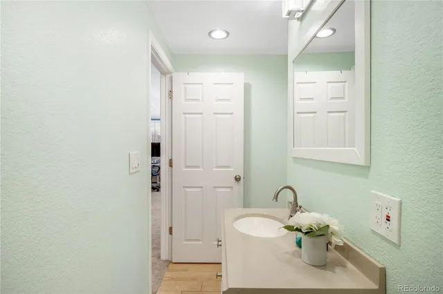 a view of a patio with table and chairs potted plants and a large tree