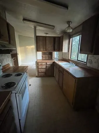 a bathroom with a double vanity sink and a bathtub