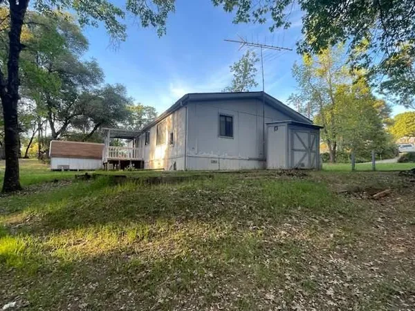 a house view with a garden space
