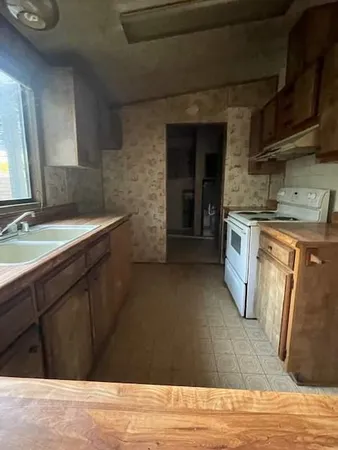 a bathroom with a sink and mirror