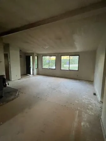 a view of empty room with windows