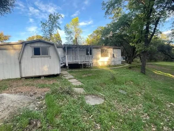 a house view with a garden space