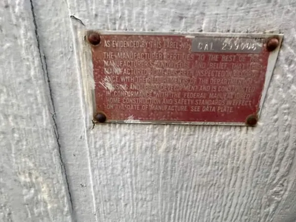 a view of a house with large trees