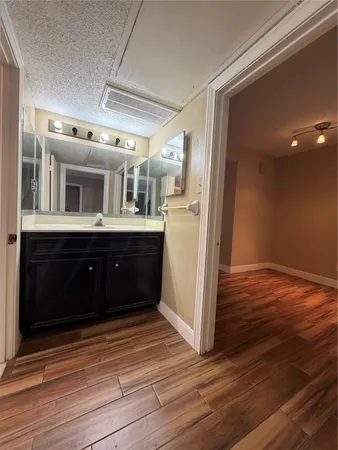 a view of kitchen and wooden floor