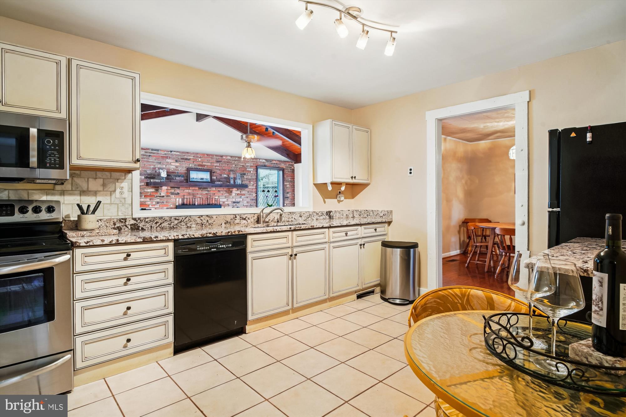 2845 Carrollton Road Annapolis, MD 21403 - Photo 13 of 47 a kitchen with stainless steel appliances kitchen island granite countertop a sink and cabinets