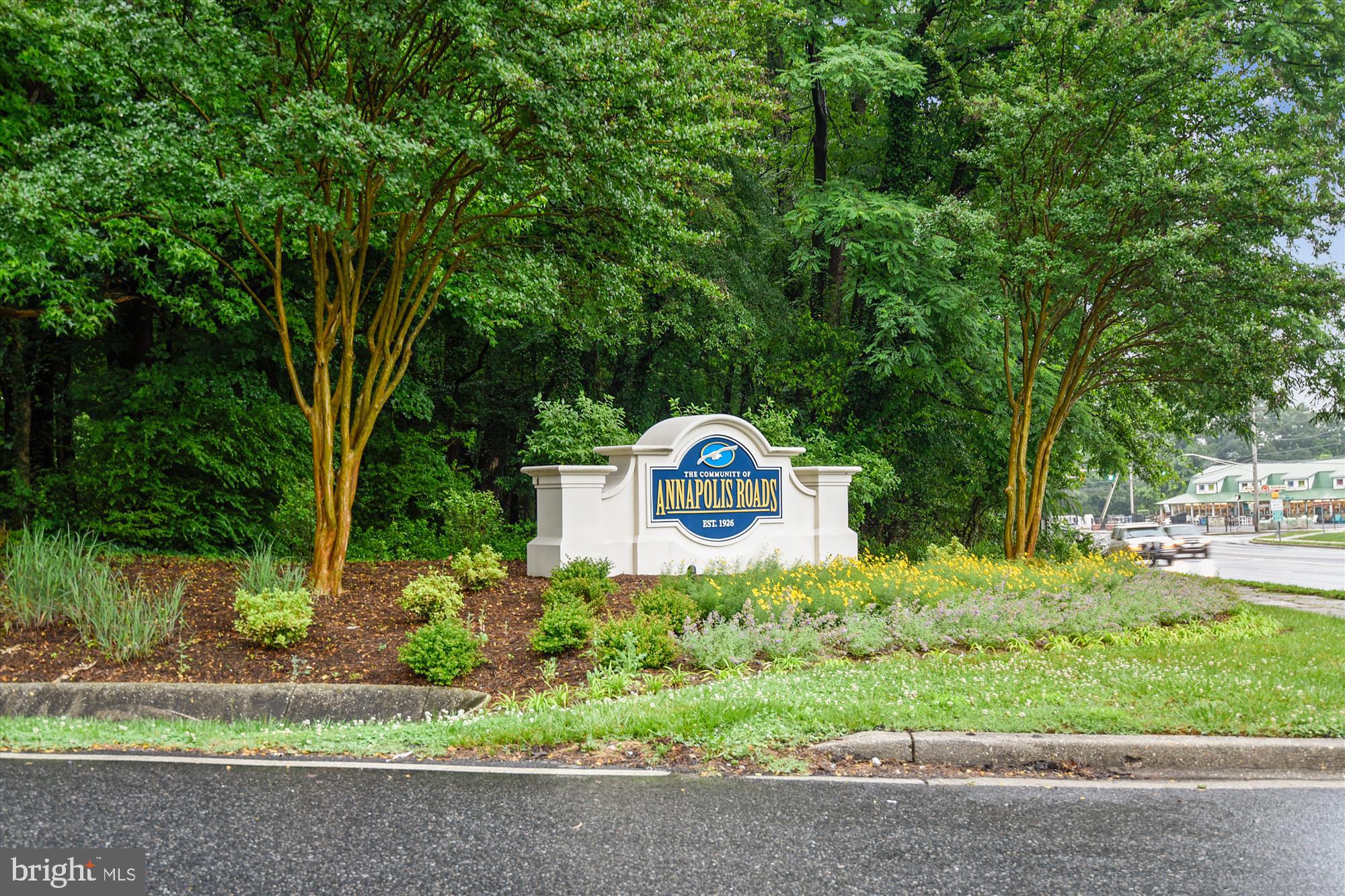 2845 Carrollton Road Annapolis, MD 21403 - Photo 32 of 47 a front view of a house with a yard and potted plants