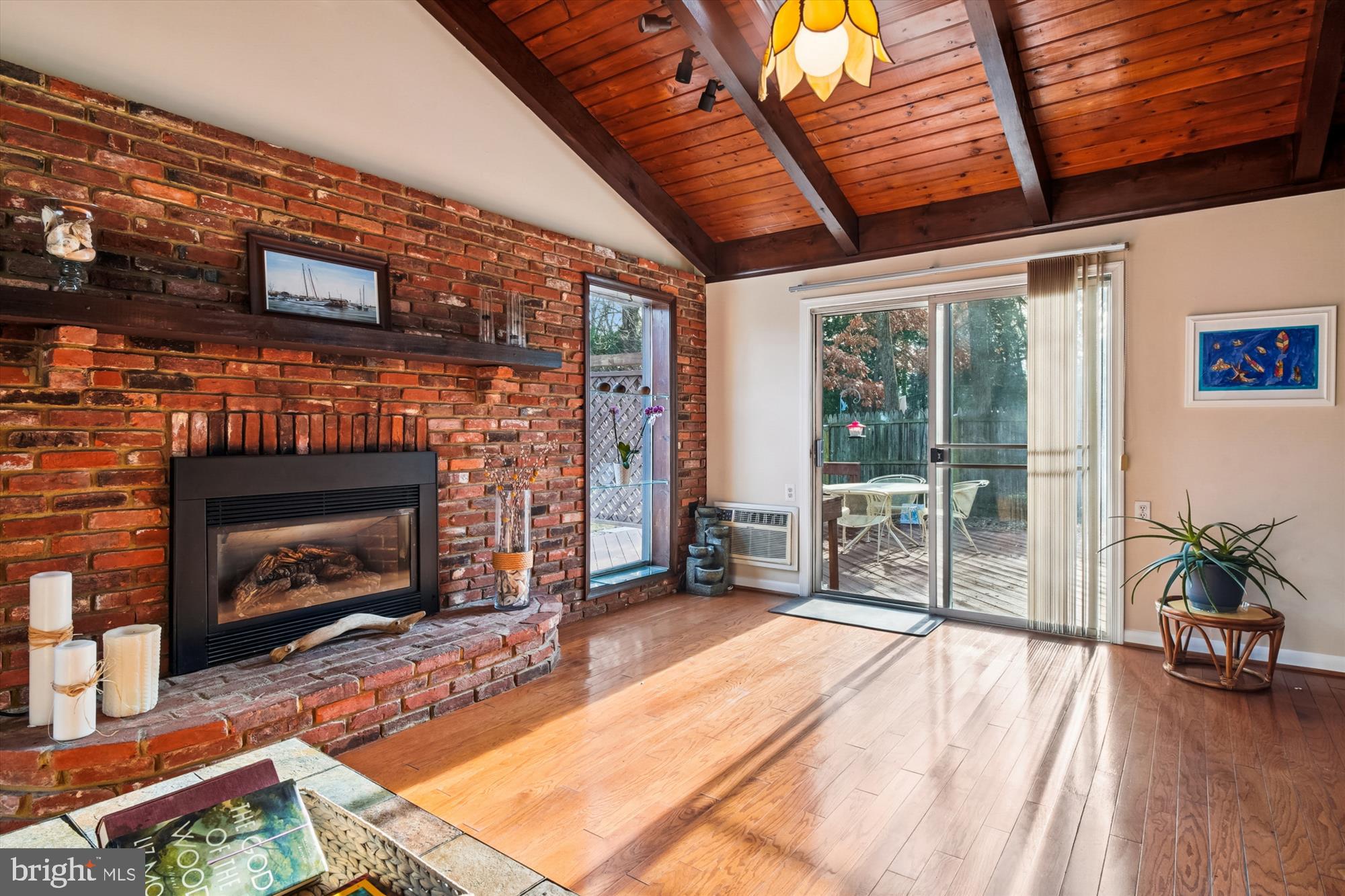 2845 Carrollton Road Annapolis, MD 21403 - Photo 8 of 47 a living room with furniture wooden floor a fireplace and a flat screen tv