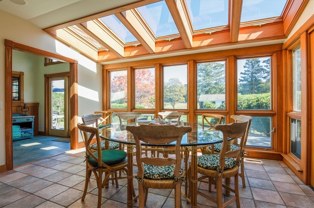 9E Bradford Road Westerly, RI 02808 - Photo 12 of 49 Glass Enclosed Dining Area Overlooking Back Deck