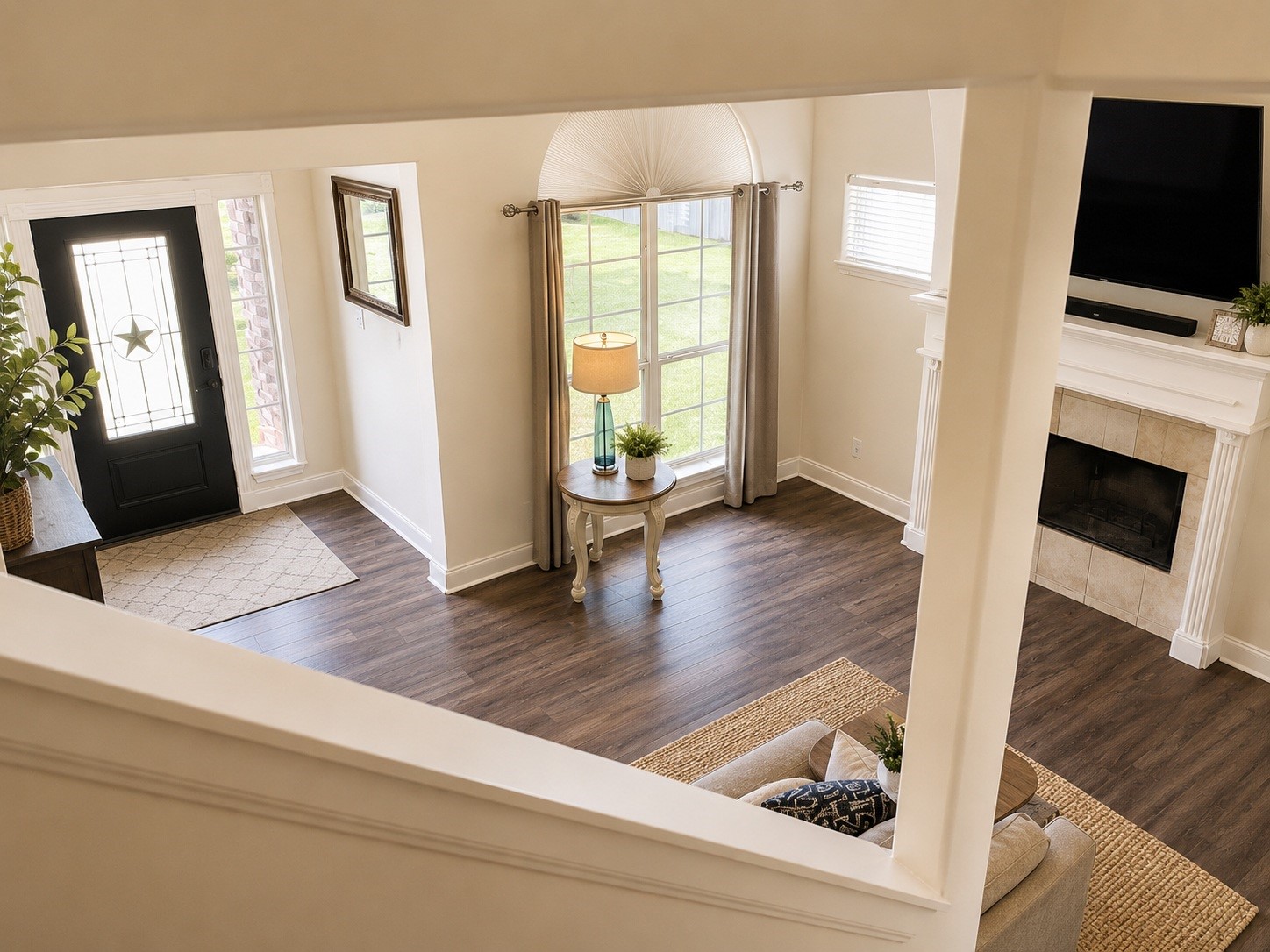 803 Brickstone Court Spring, TX 77386 - Photo 16 of 26 View of front door and living room from stairway. Updated flooring throughout