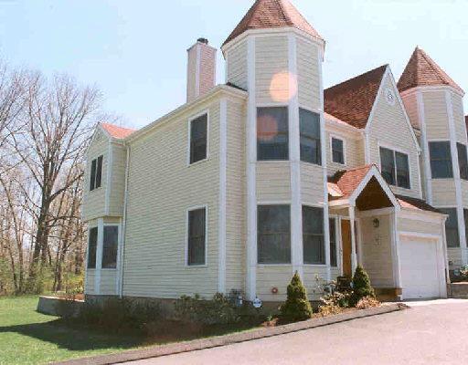 59 Prospect Street, Unit 4L Ridgefield, CT 06877 - Photo 1 of 1 a front view of a house with yard