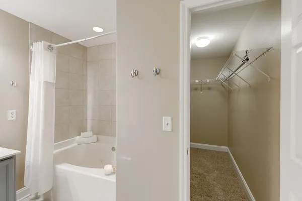a bathroom with a shower and a tub