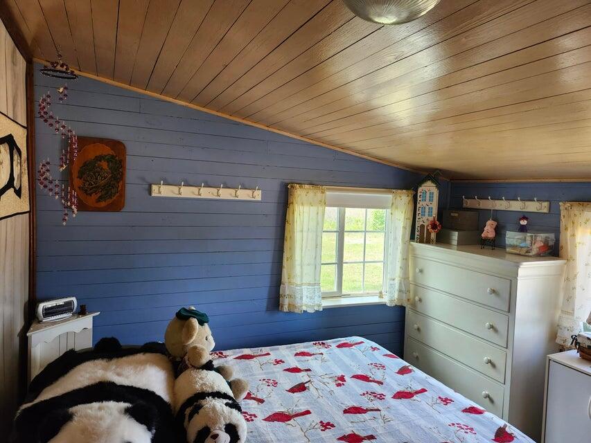 258 Briar Road DeFuniak Springs, FL 32433 - Photo 11 of 25 a bedroom with a bed and a dresser