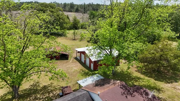a backyard of a house with lots of green space