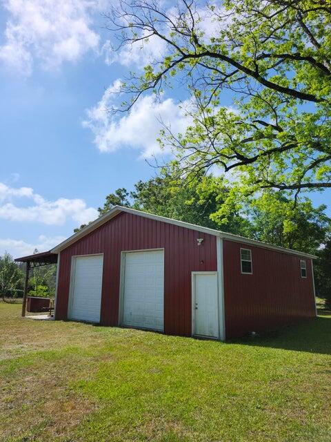 258 Briar Road DeFuniak Springs, FL 32433 - Photo 22 of 25 a backyard of a house with lots of green space