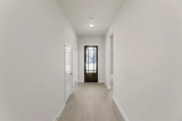 a view of hallway with windows
