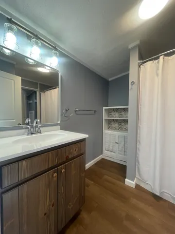 a bathroom with a sink and a mirror