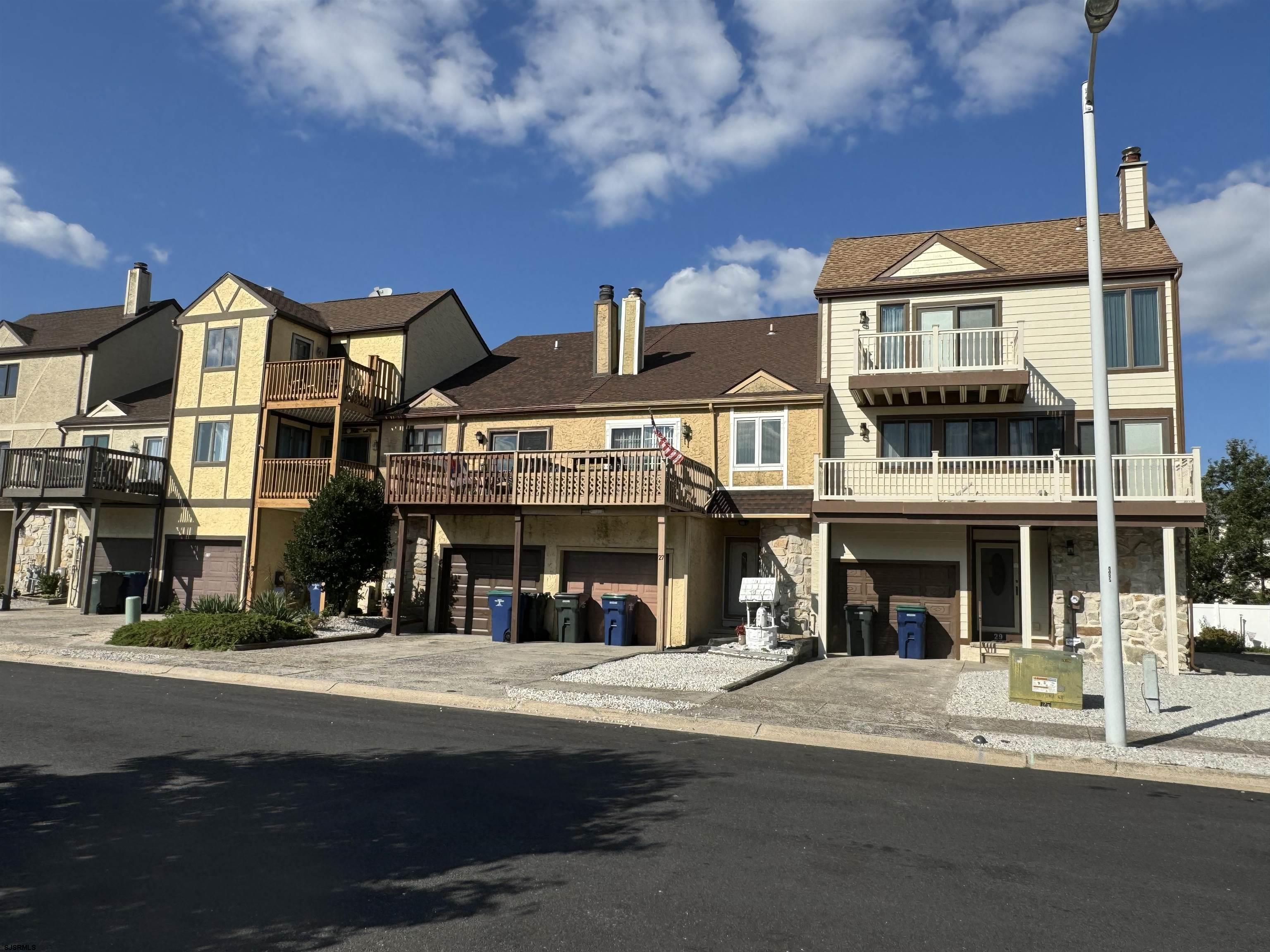 a front view of a building with a street view