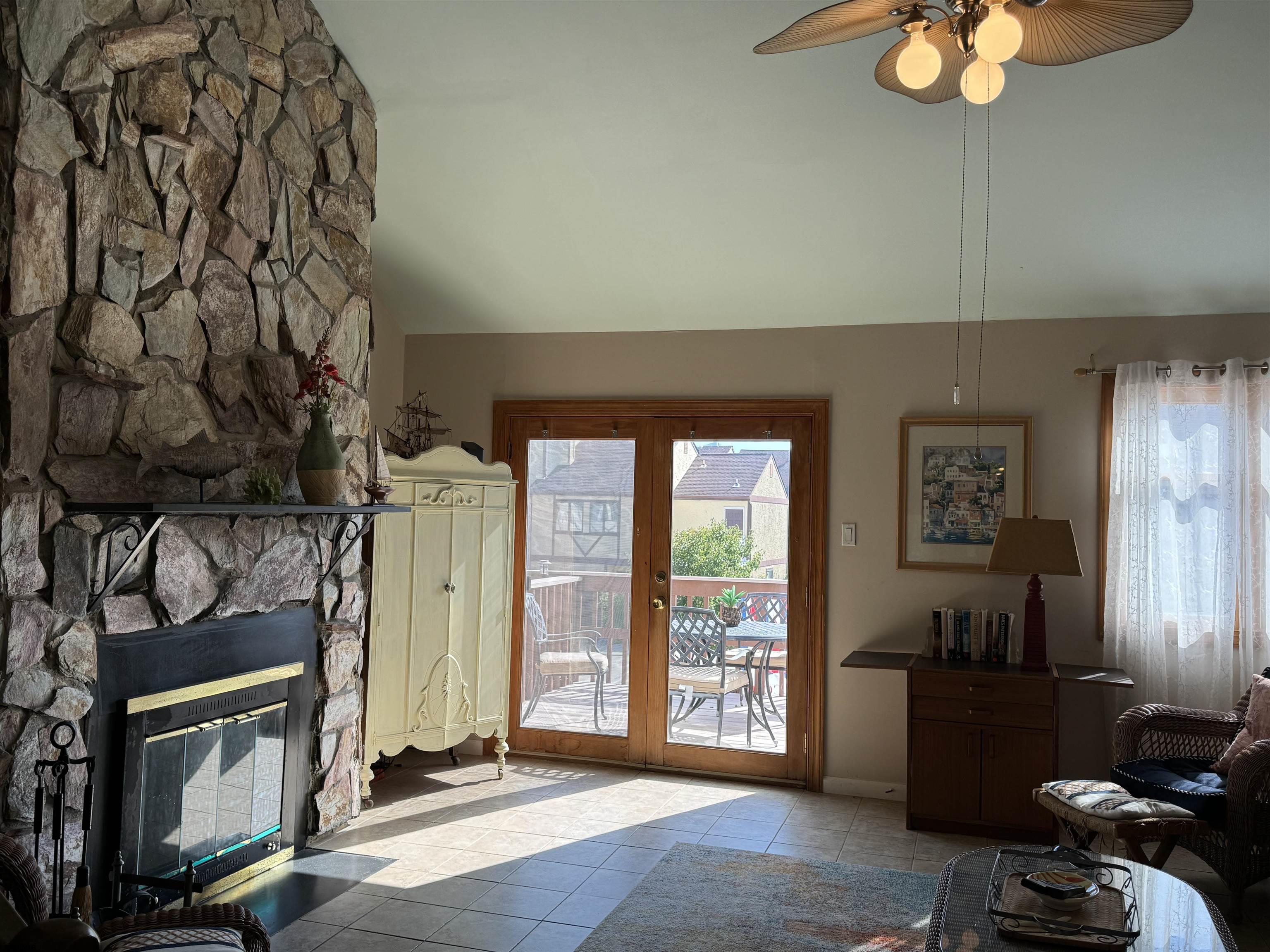 25 Beacon Lane Brigantine, NJ 08203 - Photo 13 of 36 a living room with furniture and a fireplace