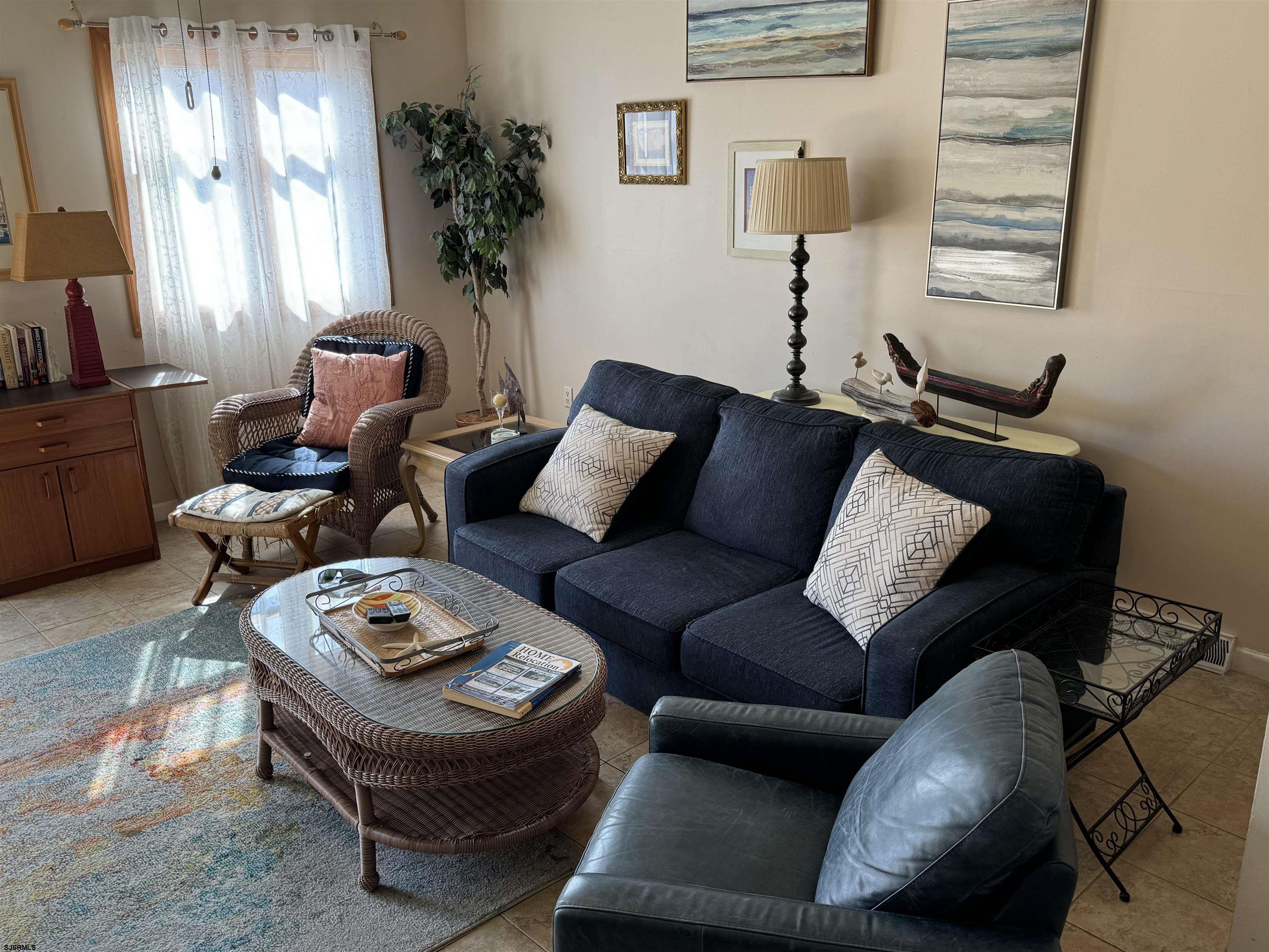 25 Beacon Lane Brigantine, NJ 08203 - Photo 15 of 36 a living room with furniture potted plant and a window