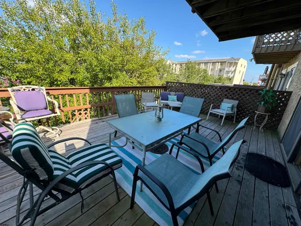 a view of balcony with furniture and wooden deck