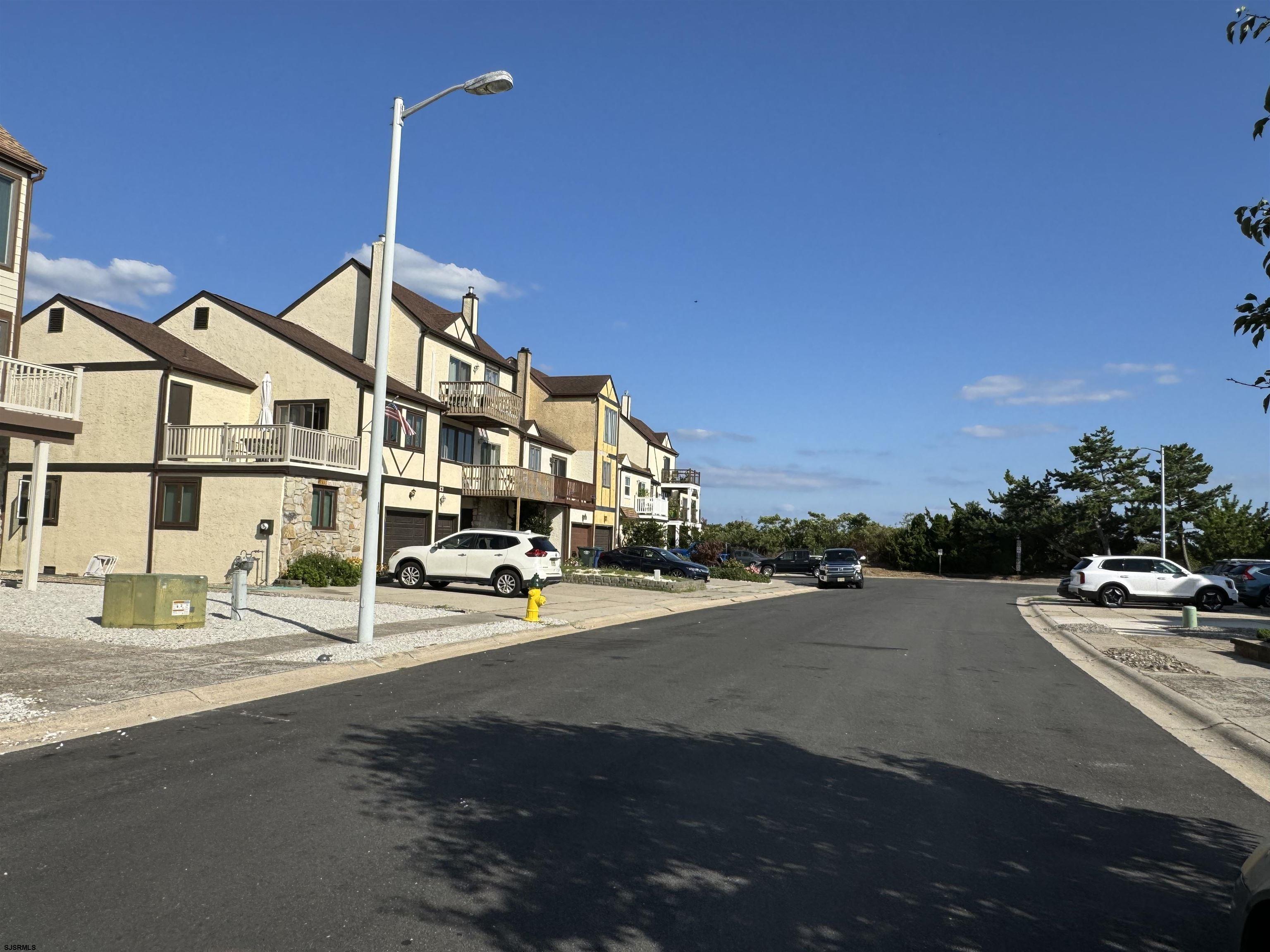25 Beacon Lane Brigantine, NJ 08203 - Photo 2 of 36 a car parked on the side of the road