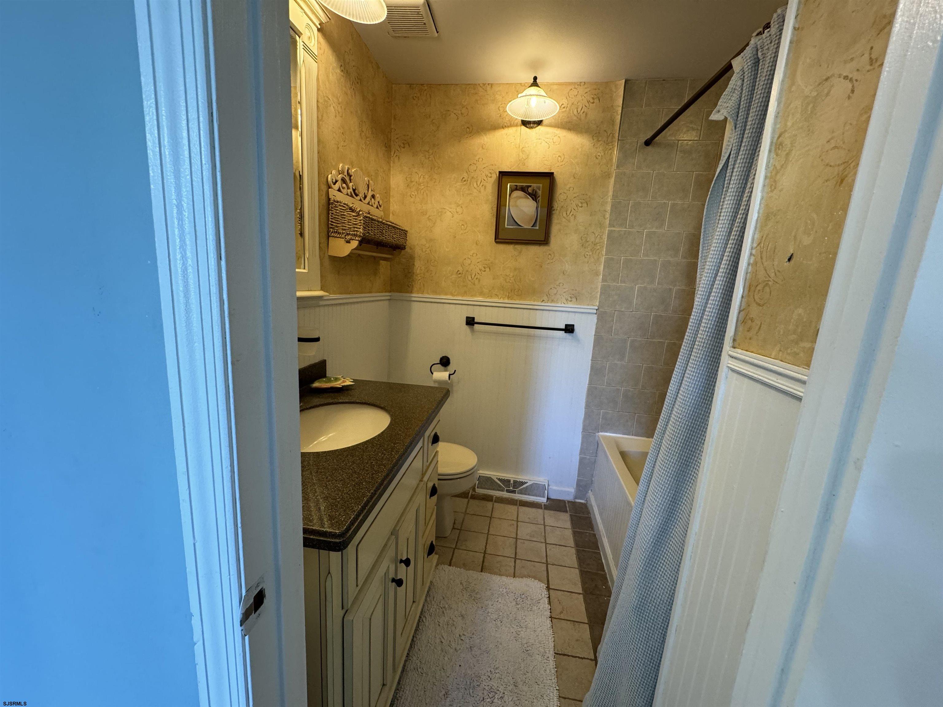 25 Beacon Lane Brigantine, NJ 08203 - Photo 28 of 36 a bathroom with a sink and mirror
