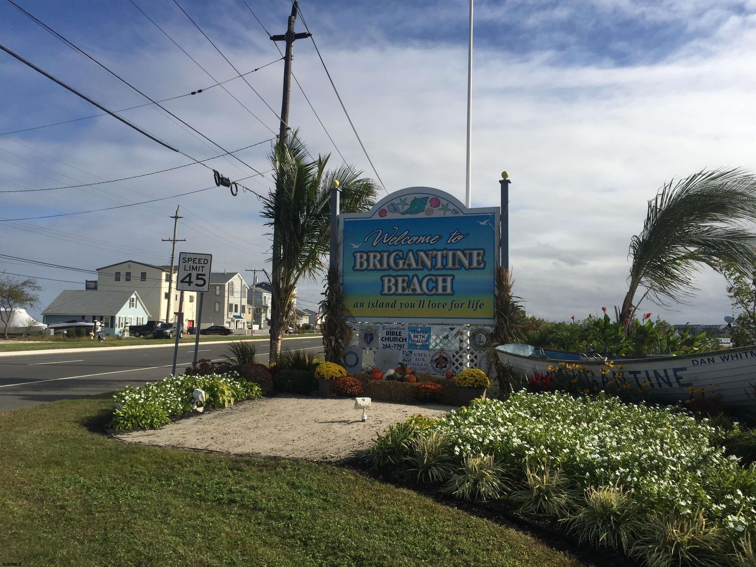 25 Beacon Lane Brigantine, NJ 08203 - Photo 36 of 37 a sign on the side of a building