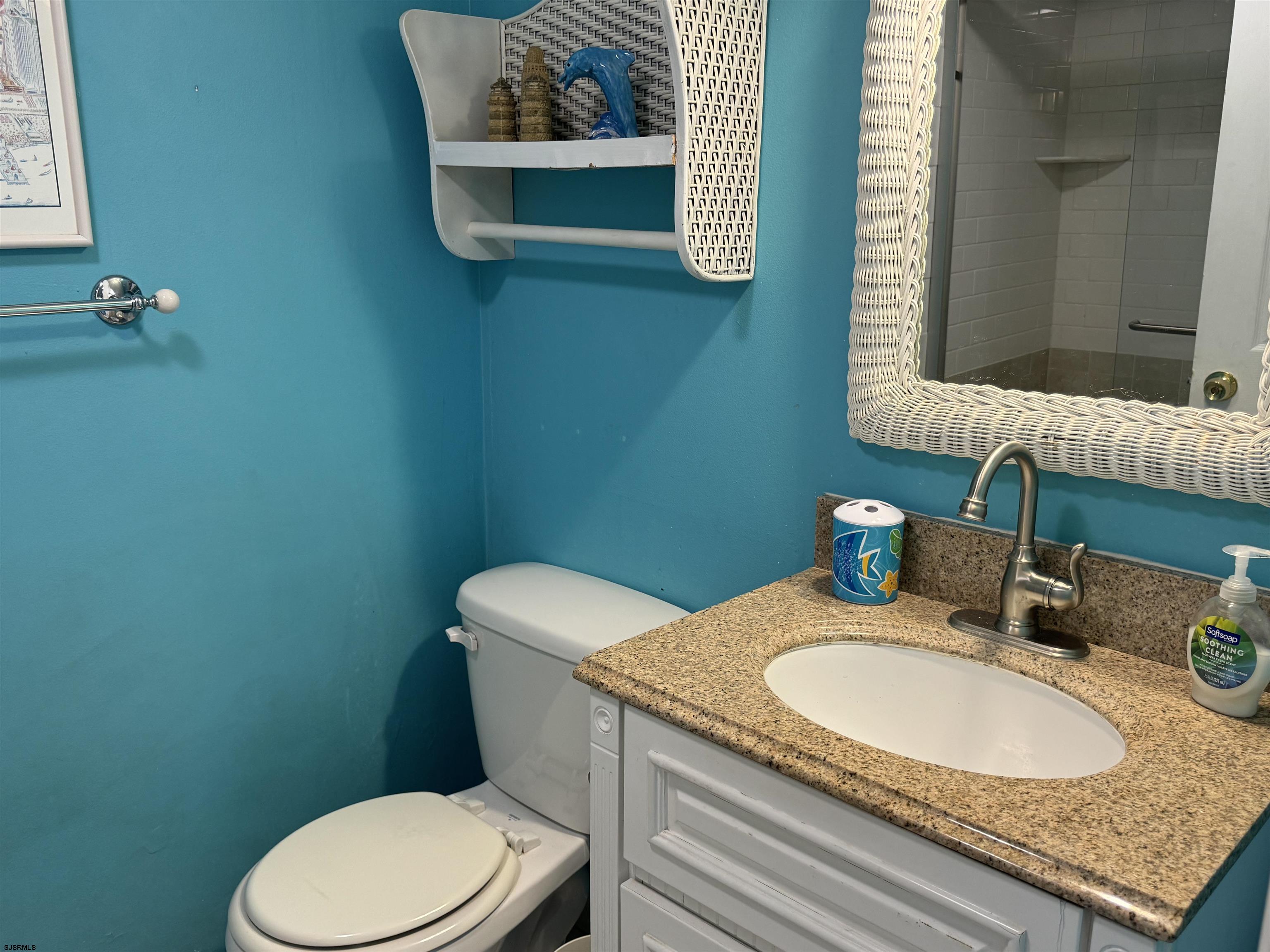 25 Beacon Lane Brigantine, NJ 08203 - Photo 8 of 36 a bathroom with a granite countertop toilet sink and mirror