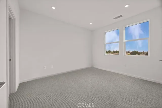 an empty room with closet area