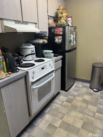 a kitchen with a stove and a microwave