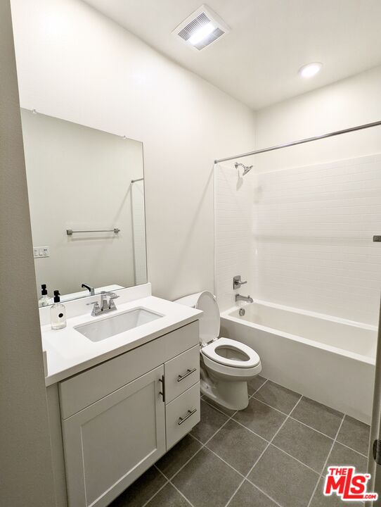7107 Ryder Ln. Gardena, CA 90248 - Photo 9 of 11 a bathroom with a double vanity sink toilet mirror and bathtub