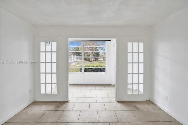 a view of an empty room with a window