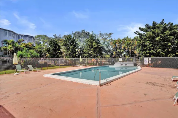 a view of outdoor space and swimming pool