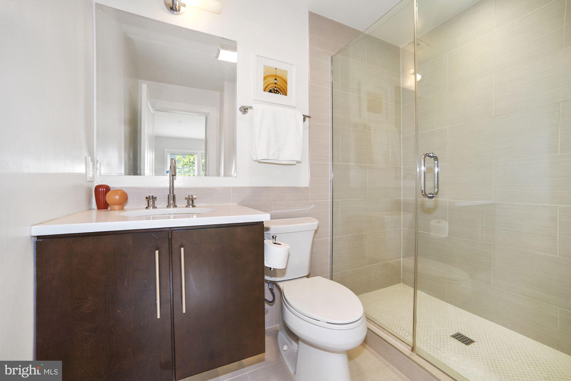 2101 11th Street Northwest, Unit 403 Washington, DC 20001 - Photo 14 of 25 Master Bath with custom tile and glass shower door