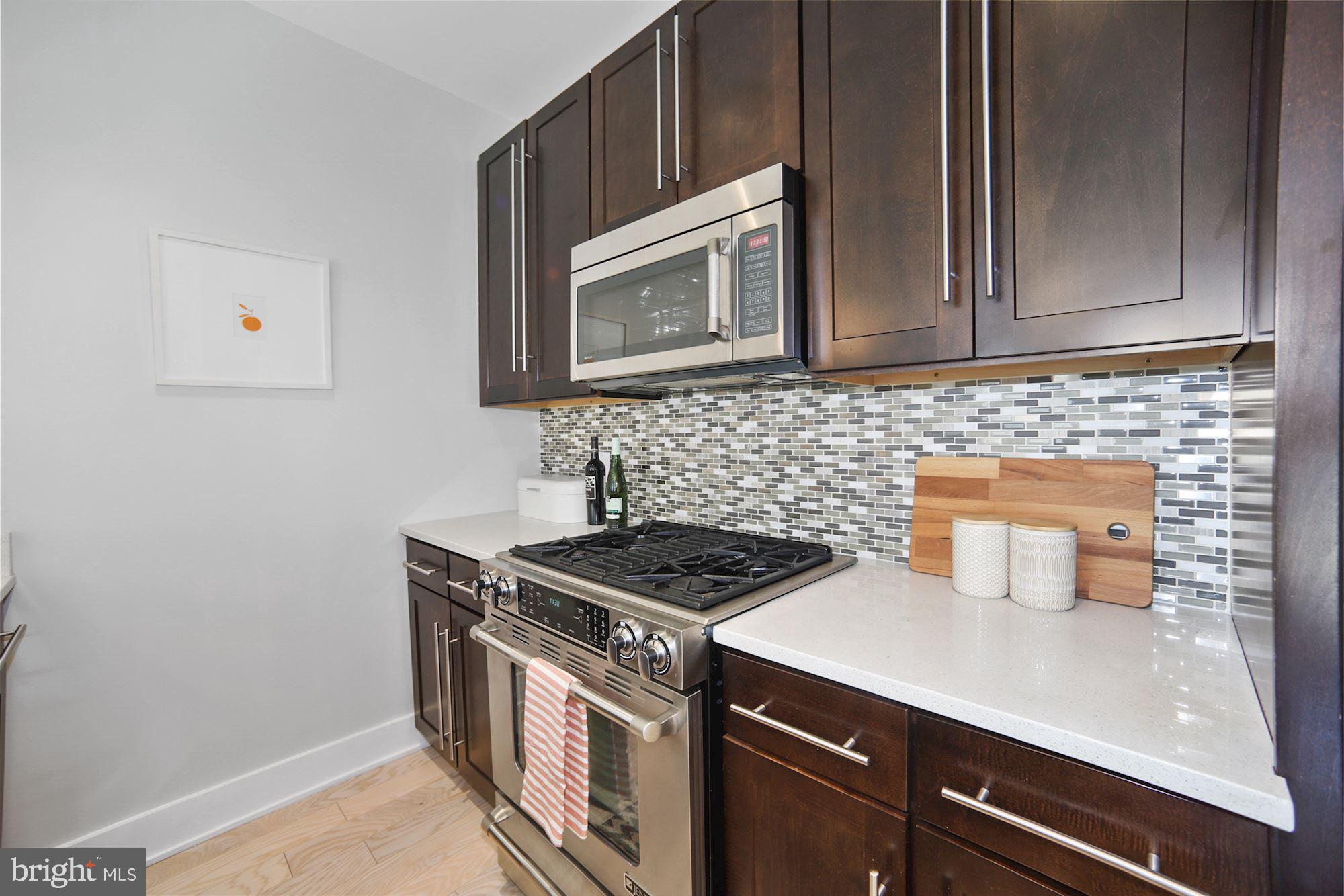 2101 11th Street Northwest, Unit 403 Washington, DC 20001 - Photo 4 of 25 Contomporary Kitchen with tile backsplash