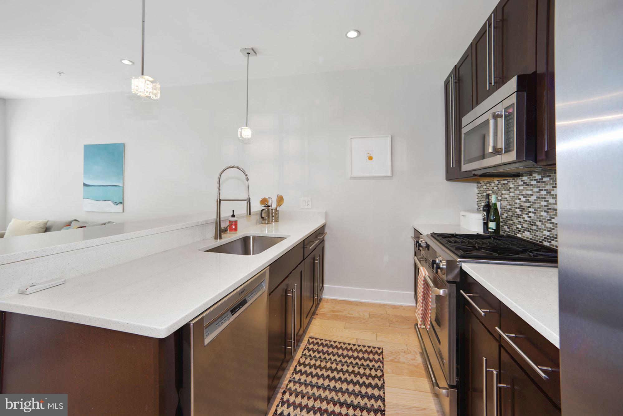 2101 11th Street Northwest, Unit 403 Washington, DC 20001 - Photo 5 of 25 Kitchen w/quartz counter and island