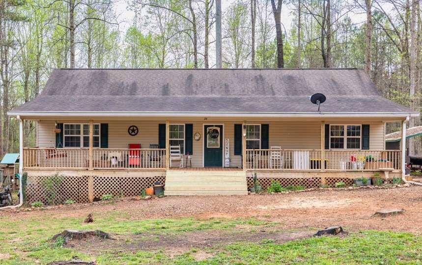 134 Brown Bridge Road Commerce, GA 30530 - Photo 1 of 1 a front view of a house with garden and porch