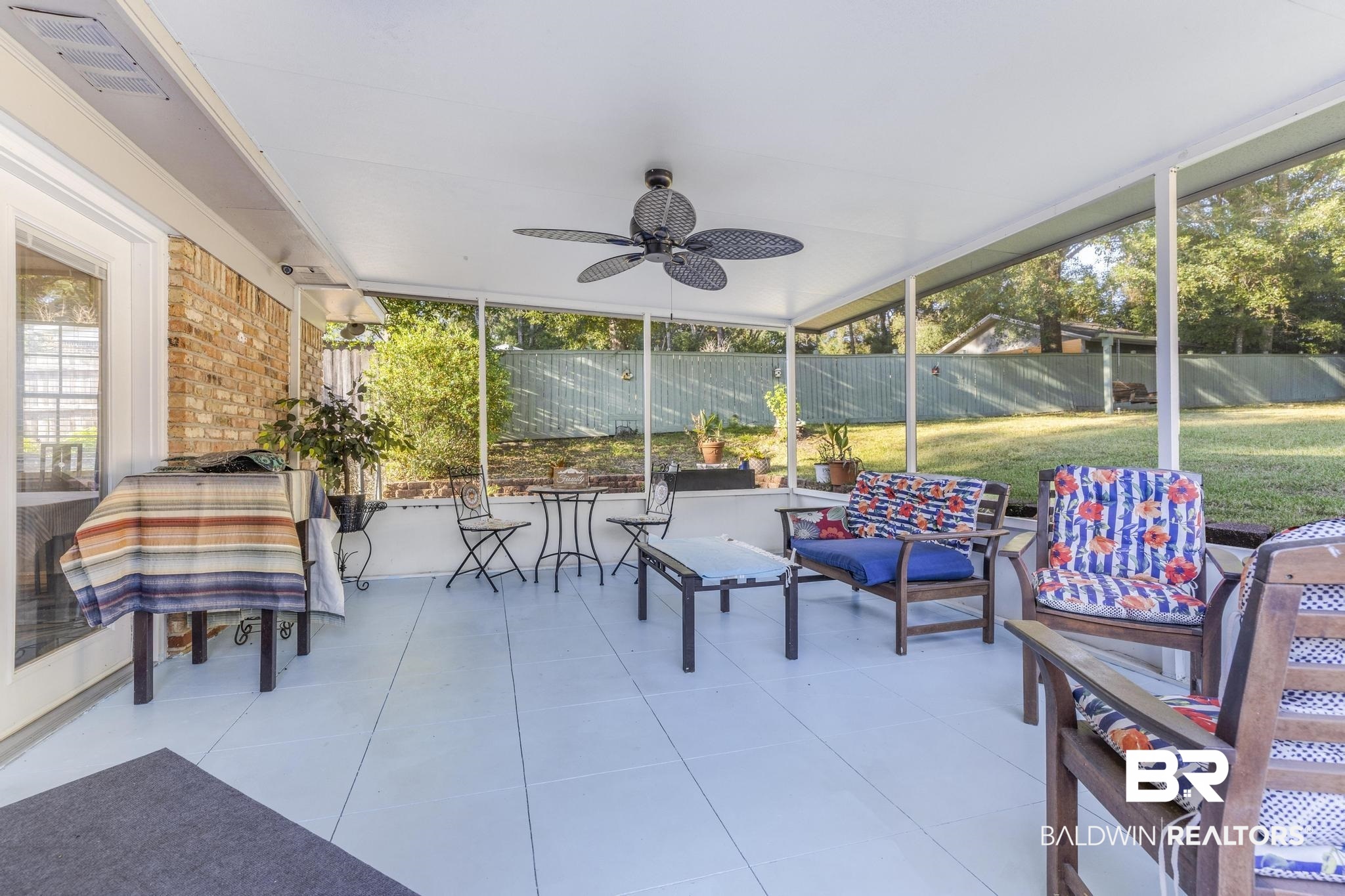 2573 E Road Mobile, AL 36693 - Photo 25 of 45 Sunroom with ceiling fan and outdoor lounge area