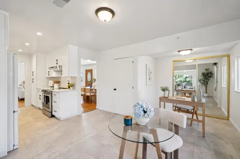 a kitchen with a table and chairs in it