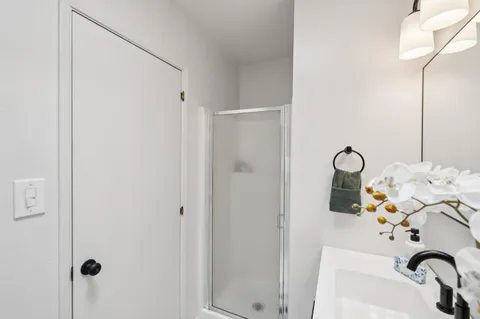 a bathroom with a sink and mirror