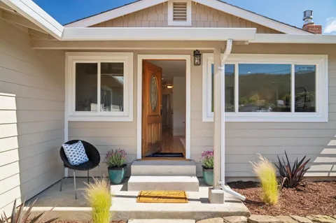 a front view of a house with patio