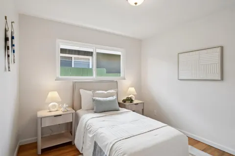 a bedroom with a bed and window