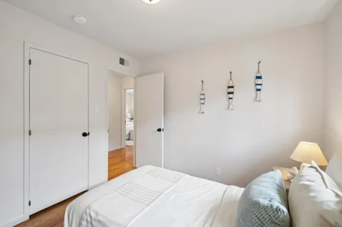 a bedroom with a bed and a closet