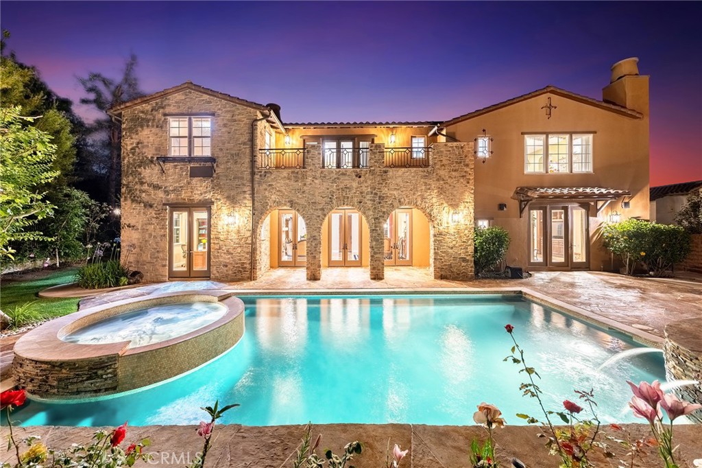 a view of a house with swimming pool