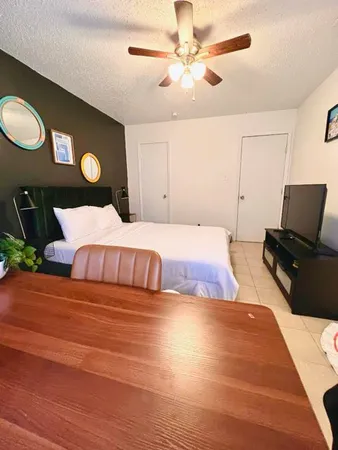 a bedroom with a bed and window