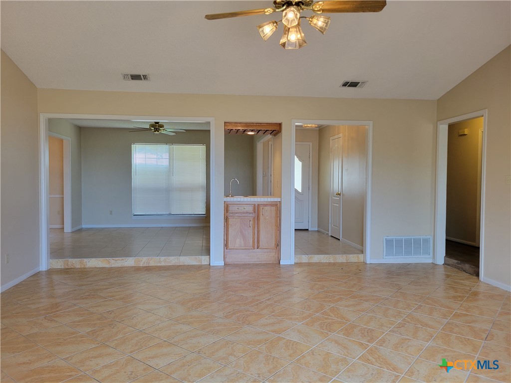 1511 Wild Ridge Drive Harker Heights, TX 76548 - Photo 3 of 29 an empty room with kitchen view and wooden floor
