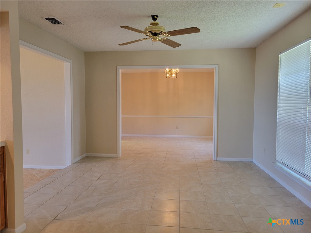 1511 Wild Ridge Drive Harker Heights, TX 76548 - Photo 7 of 29 an empty room with fan and entrance
